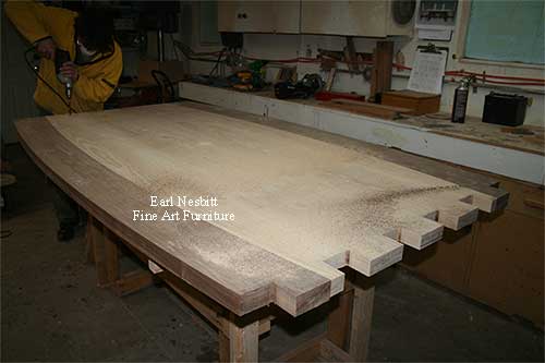 Earl drilling tenons on one end of custom made dining table